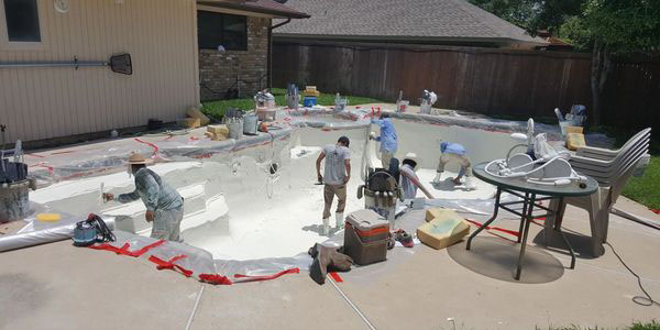 The team laying plaster for a pool in Richardson Texas.